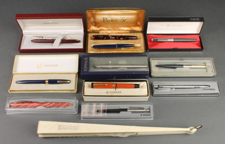 A red marble Parker Duofold fountain pen, a blue Parker 17 lady, a grey Parker 61 and 8 other pens and pencils 