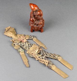 An Oriental figure, the body made up of cash 12" and a softwood figure of a seated gentleman 5" 