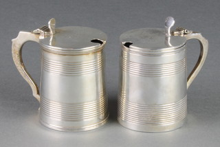 A pair of George III silver ribbed mustards with chased armorials, 1 marked London 1796 the other date letter rubbed, 248 grams