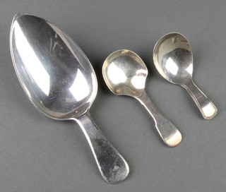 A Victorian silver fiddle pattern caddy spoon London 1860, a Georgian ditto and a Georgian serving spoon, 106 grams