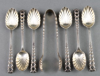 A set of 6 silver teaspoons and nips with shell bowls and pierced handles, Sheffield 1917, 106 grams