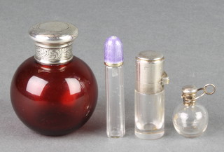 A silver mounted ruby glass globular scent bottle 3 1/2" and 3 other mounted bottles