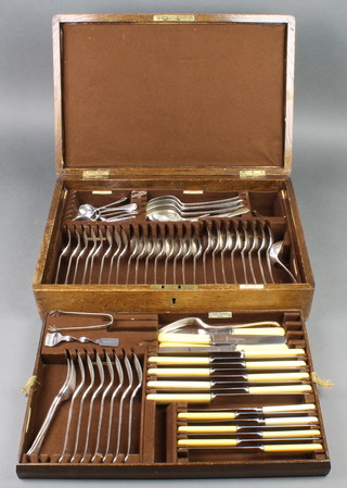 An oak canteen of silver plated cutlery