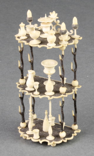 A Victorian miniature turned and stained bone 3 tier what-not with vessels 3 1/2" 