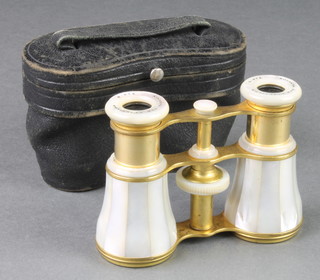 A pair of 19th Century Palais Royale gilt and mother of pearl opera glasses Societe des Lunetiers Paris, cased