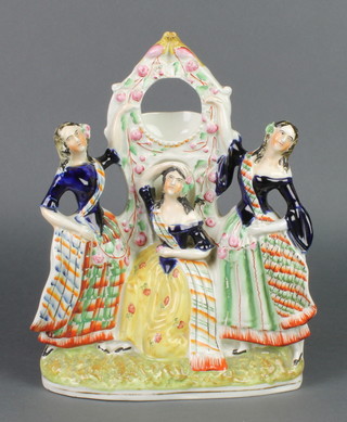 A Victorian Staffordshire watch holder in the form of 3 standing ladies surmounted by 2 birds 12" 