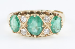 A Victorian style 18ct yellow gold emerald and diamond ring, size N 1/2