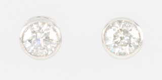 A pair of 18ct white gold single stone ear studs 0.8ct