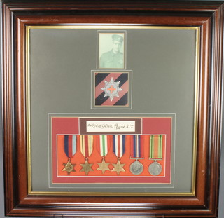 A World War II group 1939-45 Africa, Italy and France and Germany Stars, British War medal and Defence medal to 2659515 GDMN. Bayne.R.T. framed with facsimile badge and photograph