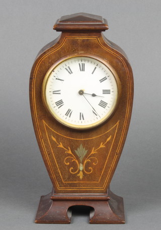 A French bedroom timepiece with enamelled dial and Roman numerals, contained in a shaped inlaid mahogany case, the back plate marked R & Co Paris