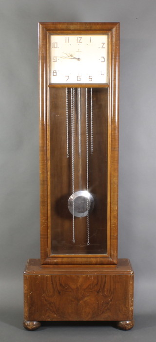 A Vedette Art Deco 8 day striking longcase clock with 14" rectangular silvered dial striking on a gong contained in a walnut case raised on bun feet 77"h