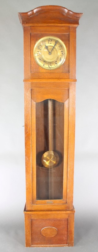 An Edwardian 8 day striking longcase clock, the 10 1/2" circular embossed dial with Arabic numerals, contained in an oak case 81"h 