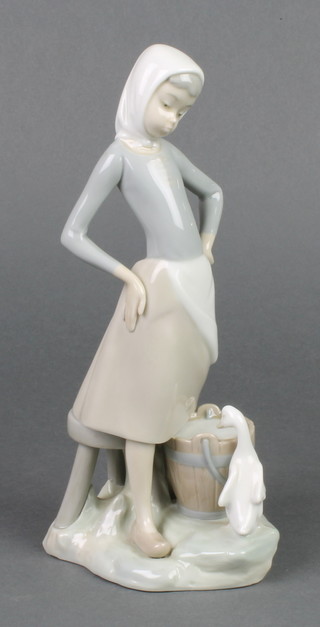 A Lladro group of a water carrier with a goose at her feet 9 1/2" 
