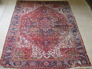 A Persian Heriz blue and white ground carpet, some moth and wear 166" x 132" 
