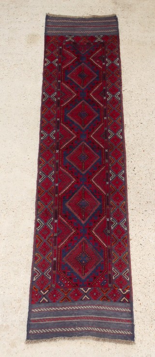 A contemporary red and blue ground Meshwani runner with 5 diamonds to the centre 99" x 24" 