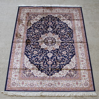 A contemporary blue ground Belgian cotton Keshan style rug with central medallion 89" x 64" 
