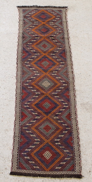 A contemporary Kilim tan ground runner with 8 octagons the centre 85" x 23" 