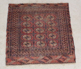 A Tekke red ground Bokhara rug with 15 octagons to the centre 48" x 49" 