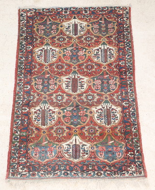 A Bakhtiari brown ground rug 81" x 52 1/2", some wear
