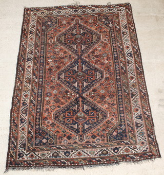 A Persian Qashqai brown and blue ground rug with 3 diamond medallions to the centre 116" x 81" 