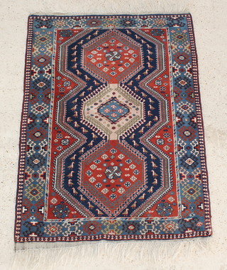A Persian Yalameh  blue and tan ground rug with 3 diamonds to the centre 60" x 43" 