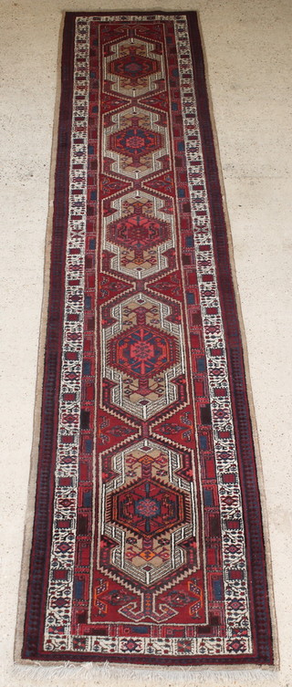 A Persian Sarab red and blue ground runner with 5 diamonds to the centre 177" x 40" 