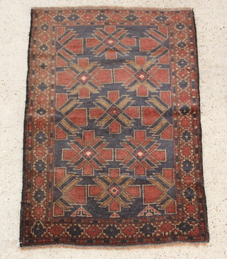 A contemporary tan and black ground Belochi rug 47" x 33"  