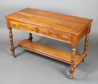 A Victorian carved mahogany side table fitted 2 drawers, the base with undertier, raised on turned supports 30"h x 48"w x 23"d  