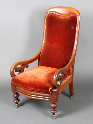 A Victorian mahogany show frame armchair upholstered in orange material 