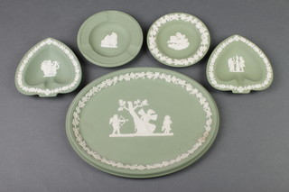 A Wedgwood green Jasper oval tray decorated with figures 10" and 4 shaped dishes