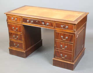 A Georgian style mahogany kneehole pedestal desk with inset leather writing surface, fitted 1 long and 8 short drawers, 30"h x 49"w x 24"d 