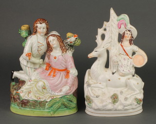 A Victorian Staffordshire group of a female warrior with deer 11", a ditto of a courting couple 10" 