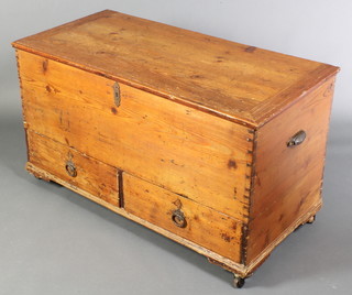 A George III pine mule chest with hinged lid, the base fitted 2 drawers and having later metal carrying handles to the sides 24"h x 42" x 20" 
