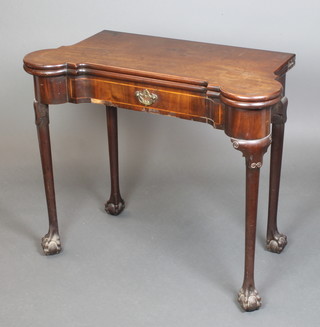 A George III mahogany shaped card table of serpentine outline, raised on club supports with ball and claw feet 29"h x 35"w x 17"d 