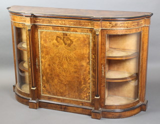 A mid Victorian inlaid and figured walnut credenza with gilt metal mounts, the centre section enclosed by an inlaid panelled door flanked by bowed doors 39"h x 61 1/2"w x 17 1/2"d