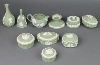 A Wedgwood green Jasper circular box and cover with vinous decoration 3", 5 other lidded boxes, a chamber stick, a jug, bell and vase