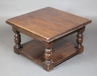A 17th Century style square oak 2 tier occasional table, the top formed of 4 planks, raised on cup and cover supports with undertier 18 1/2"h x 30" square