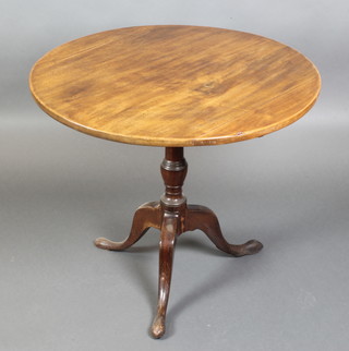 A George III mahogany oval snap top tea table, raised on a pillar and tripod base 29"h x 33" diam. 