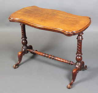 A Victorian mahogany stretcher table of serpentine outline, raised on turned supports with H framed stretcher 26"h x 36"w x 19"d