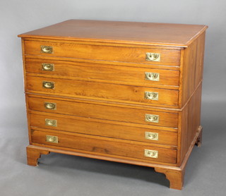 An oak military style plan chest, fitted 6 long drawers with brass countersunk handles, raised on bracket feet 38"h x 46"w x 31 1/2"d 