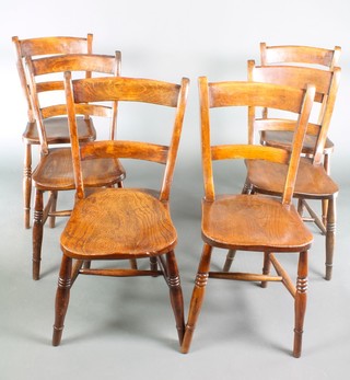A set of 6 19th Century elm Windsor bar back chairs with solid seats raised on turned supports with H framed stretcher
