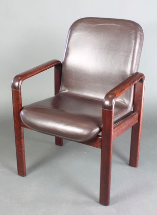 A mid Century Danish rosewood open arm chair by Dyrlund