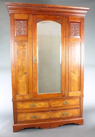 A Victorian carved walnut wardrobe with moulded and dentil cornice, enclosed by an arched bevelled plate mirror panelled door, having carved panels to the sides, the base fitted 3 drawers, raised on cabriole supports 81"h x 53"w x 22"d  