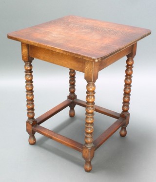 A 1930's square oak occasional table raised on bobbin turned supports with box framed stretcher 29" x 24" square 
