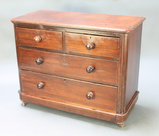 A Victorian mahogany chest of 2 short and 2 long drawers with turned wood handles, raised on casters 32"h x 41"w x 19"d 
