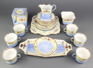 A Chelsea Art Deco tea set comprising 6 tea cups, 7 saucers, 6 octagonal sandwich plates, 6 small plates 2 serving plates, a milk jug, sugar bowl and square teapot