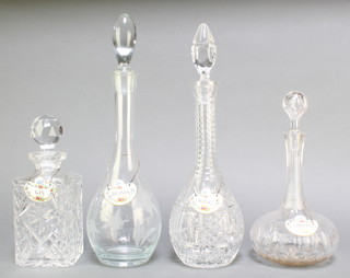 A cut glass square spirit decanter and stopper 9", a baluster ditto 10", 2 others 14"