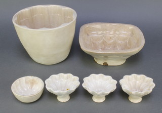 A Victorian tall jelly mould 6 1/2", a rectangular smaller ditto, 3 ovoid and  1 circular mould