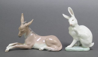 A Lladro figure of a seated hare 5667 5" together with a reclining donkey 6 1/2" 