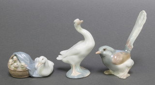 A Lladro figure of a  bird 5 1/2", a ditto of a goose 4 3/4", a group of a goose and goslings in a basket 4" 